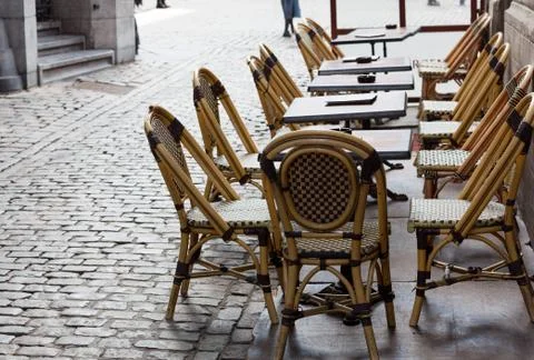 Empty cafe tables in brussels cobbled square Stock Photos