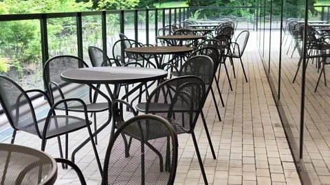 Empty cafe terrace with dark metal tables and chairs Stock Footage 340437593