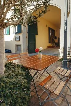 Empty cafe terrace with white table and chair. exterior of the cafe restaurant. Stock Photos