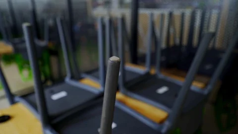 An empty cafe without customers due to the coronavirus pandemic. Rows of chairs. Stock Footage 129394444