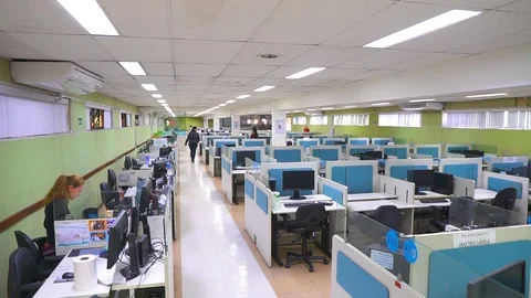 Empty call center office workspace during corona virus outbreak Stock Footage 129438692