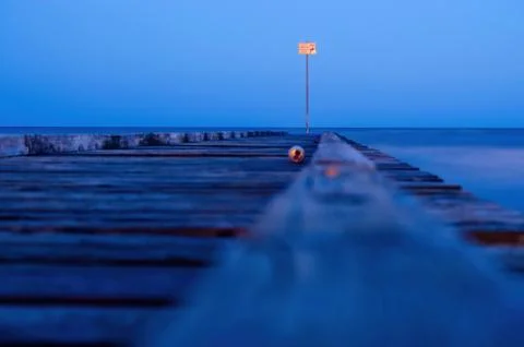 Empty can on pier at night Stock Photos