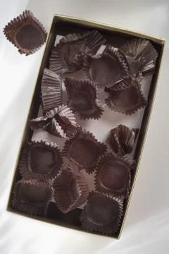 Empty candy box with wrappers Stock Photos