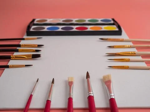 Empty canvas, tools and brushes. Place for text. Stock Photos