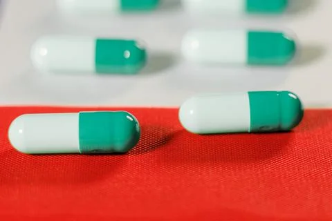 Empty capsule capsules on the USA flag. The medical system Фото