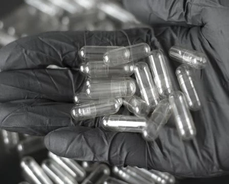 Empty capsules in the doctor's hand. Stock Photos