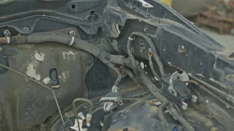 Empty car engine bay with exposed wiring and rust Stock-Footage 347035526