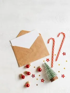 Empty card in craft envelope and various christmas decor Stock Photos