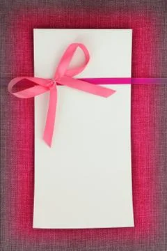 Empty card on pink fabric texture Stock Photos