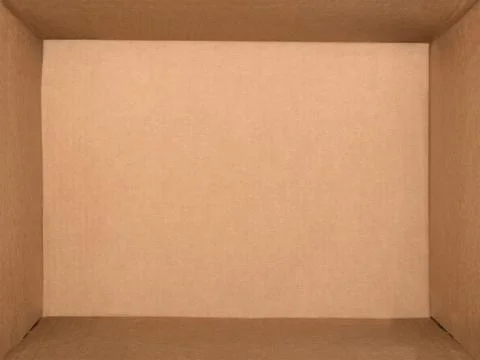 Empty cardboard box isolated on white background. Flat lay Stock Photos