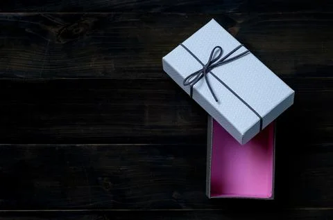 An empty cardboard box with a leather bow that is used for keeping gifts br.. Stock-Fotos