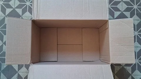 Empty cardboard box video footage showing interior brown paper texture Stock Footage 339249012