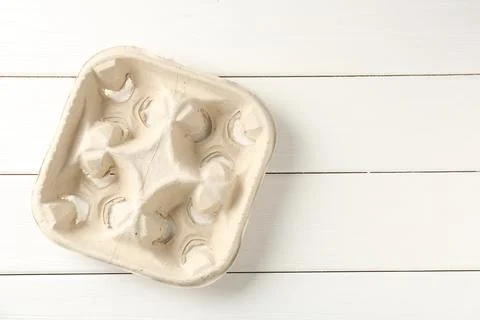 Empty cardboard cup holder on white wooden table, top view. Space for text Stock Photos