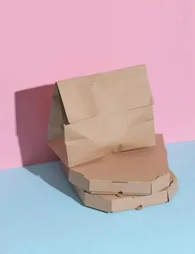 Empty cardboard pizza box open on pastel background Stock Photos
