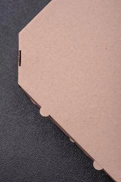 Empty cardboard rectangular brown box for delivery of delicious pizza Stock Photos