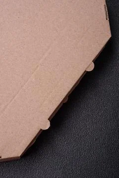 Empty cardboard rectangular brown box for delivery of delicious pizza Stock Photos