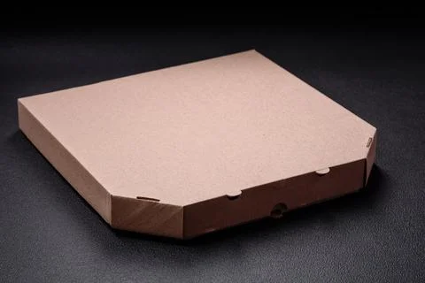 Empty cardboard rectangular brown box for delivery of delicious pizza Fotos Stock