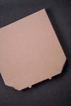 Empty cardboard rectangular brown box for delivery of delicious pizza Fotos Stock