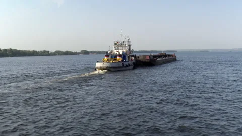 Empty cargo ship barge floats on the river on the background of the city 4k Stock Footage 157073166