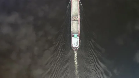 Empty cargo ship barge in narow river Stockbeeldmateriaal 154501491
