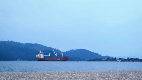 An empty cargo ship with cranes stands in the sea bay. Stock-Footage 232960457