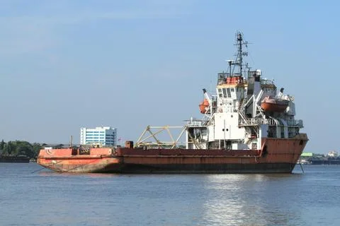 Empty cargo ship on the river Stock Photos