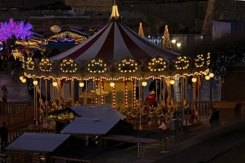 Empty carousel horses during traditional Maltese Christmas market on Triton Stock Photos