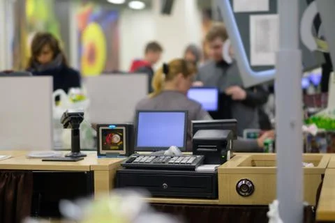 Empty cash desk with computer screen and card payment terminal with cashier.. Stock Photos