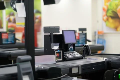 Empty cash desk with computer screen and card payment terminal on blurry ba.. Stock Photos
