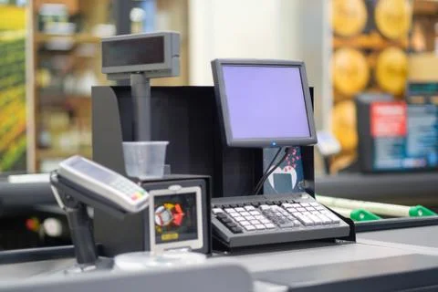 Empty cash desk with computer screen and card payment terminal on blurry ba.. Stock Photos