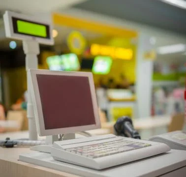 Empty cash desk with computer terinal in supermarket Stock Photos