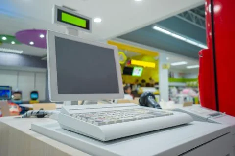 Empty cash desk with computer terinal in supermarket Stock Photos
