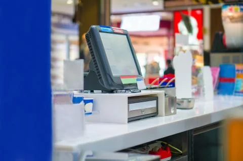 Empty cash desk with computer terminal in cafe Foto stock