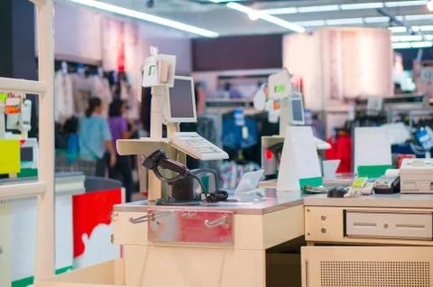 Empty cash desk with computer terminal in mall Stock Photos
