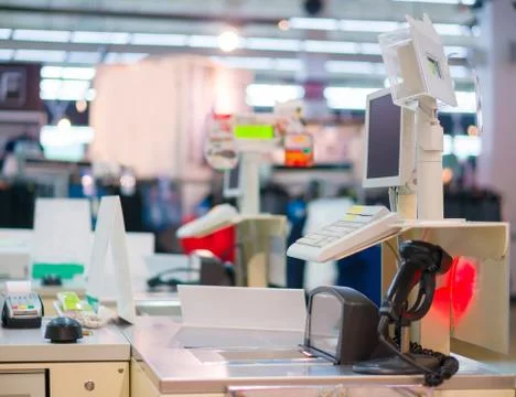 Empty cash desk with computer terminal in mall Stock Photos