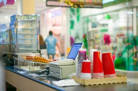 Empty cash desk with computer terminal in cafe in mall Stock Photos