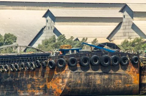 Empty cassava barges floating in river. Stock Photos