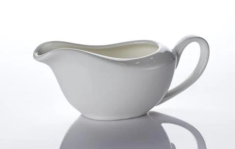 Empty ceramic creamer isolated on white background Foto stock