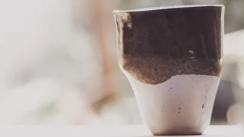 Empty ceramic cup handmade japanese on blurred nature background. You can c.. Stock Photos