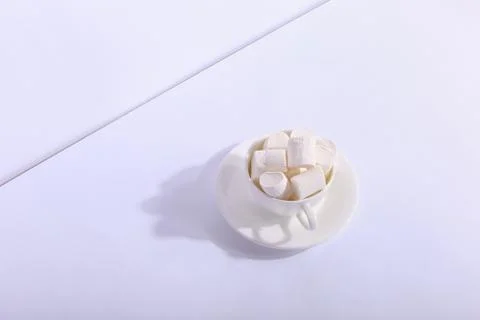 Empty ceramic cup with marshmallows on a saucer, on a white background. Hard  Stock Photos