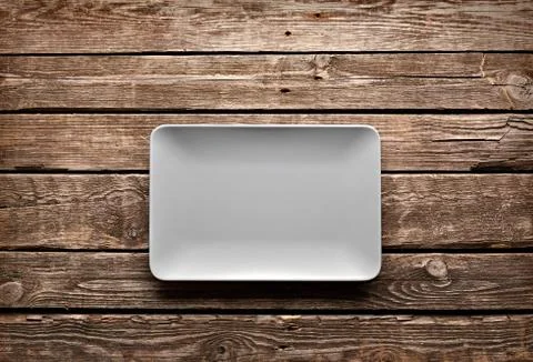 Empty ceramic dish on old table 写真素材