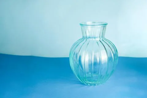 Empty ceramic flower pot, flower vase isolated on blue or light blue background Stock Photos