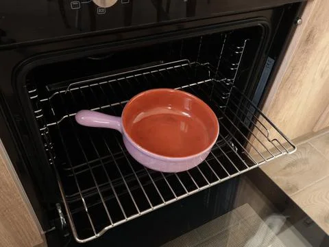 Empty ceramic pan with one handle, pot baking dish for roasting food in oven on Stock Photos
