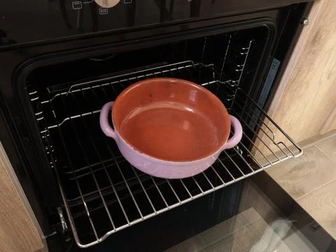Empty ceramic pan with two handle, pot baking dish for roasting food in oven on Photos