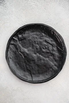Empty ceramic plate on light stone texture. Modern minimal food backdrop wi.. Stock Photos