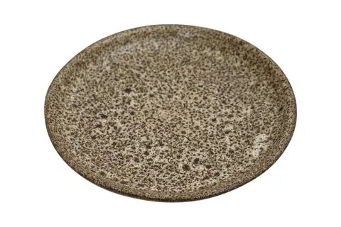 Empty ceramic plate with textured speckled pattern on white background. Rou.. Stock Photos