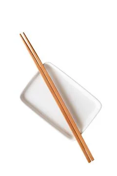 Empty ceramic rectangular plate with chopsticks isolated on white background Stock Photos