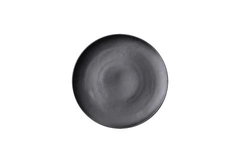 Empty ceramic round plate on dark textured concrete background Stock Photos