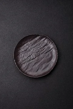 An empty ceramic round plate, kitchen utensils for a dinner table. An empty.. Stock Photos