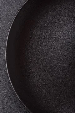An empty ceramic round plate, kitchen utensils for a dinner table. An empty.. Stock Photos